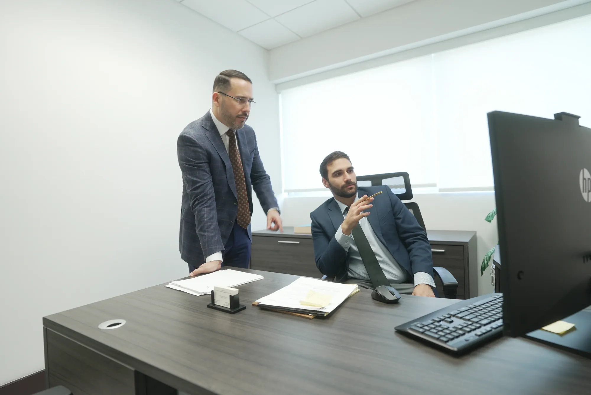 HHA Law attorney in consultation with a client from Miami's Hispanic community